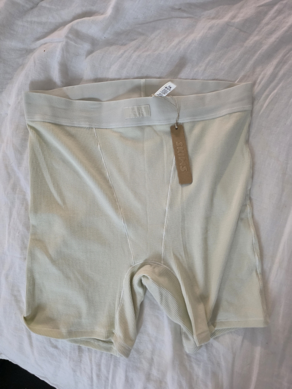 SKIMS Ribbed Bike Shorts in Bone